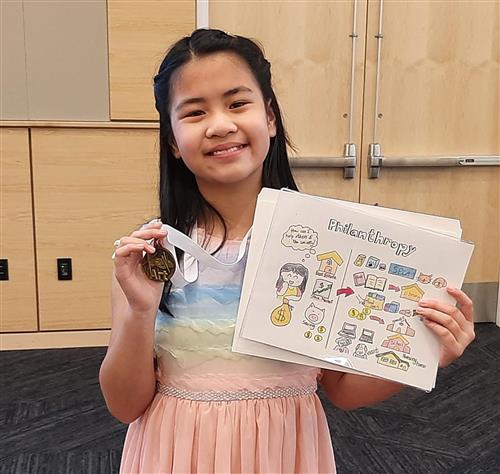 5th grade girl wins art competition for illustration of economics for The Stock Market Game